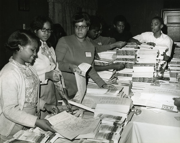 NCTE members sort through English text books at the 1969 NCTE Convention in Washington D.C., circa 1969