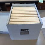 The woodblocks housed upright in their new tux and archival boxes
