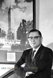 Photo of Nathan M. Newmark next to a picture of the Latino-Americana Tower in Mexico City (ca. 1965). Found in Record Series 26/4/1.