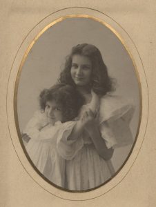 Photograph showing Helen and Jane Priscilla Sousa, two young girls in white dresses.