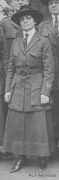 Lillian Baker Griggs (identified by author) shown in uniform. Note the patch on the left sleeve, and the open-book style pin is on both lapels and the center front of the hat.