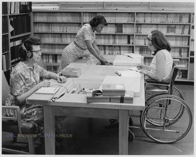 Students, including one in a wheelchair, at the Library, circa 1967